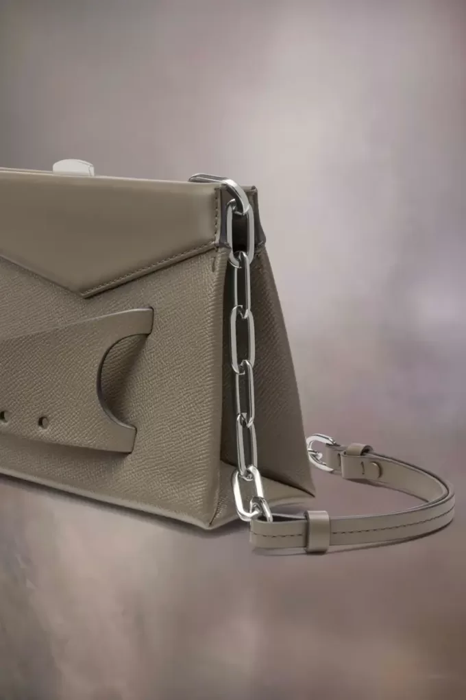 Kleine clutch met gesmokte schouder